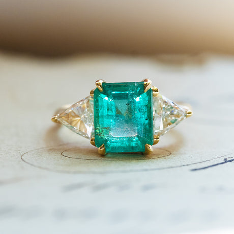 Vintage 1970s ring with emerald cut centre stone and side diamonds.