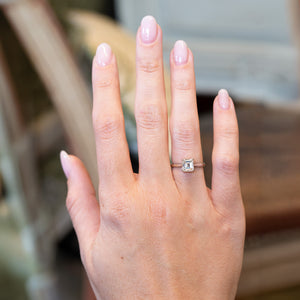 Vintage 1980s solitaire diamond ring worn on hand.
