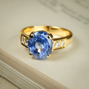 Vintage 1990s blue sapphire and diamond engagement ring in yellow gold