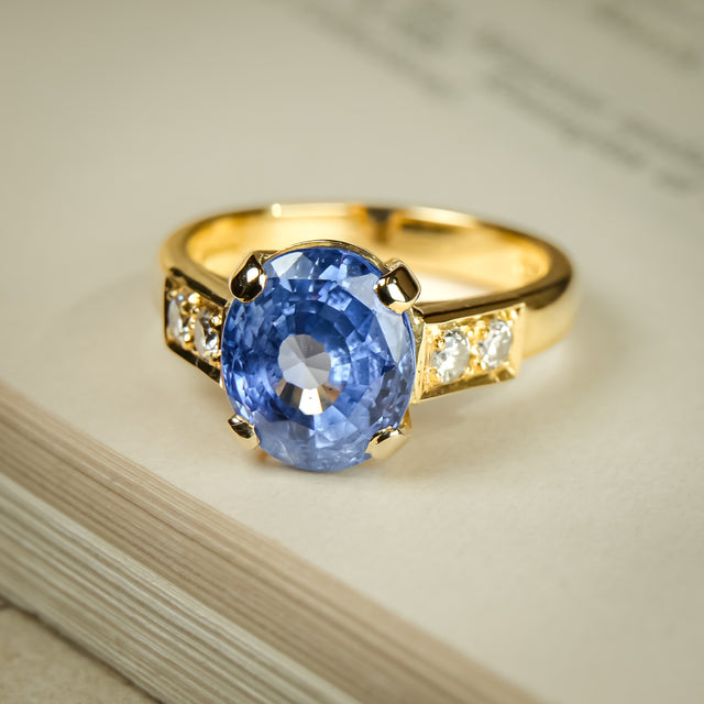 Vintage 1990s blue sapphire and diamond engagement ring in yellow gold