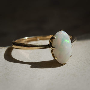 1990s precious opal solitaire ring with oval cabochon in gold