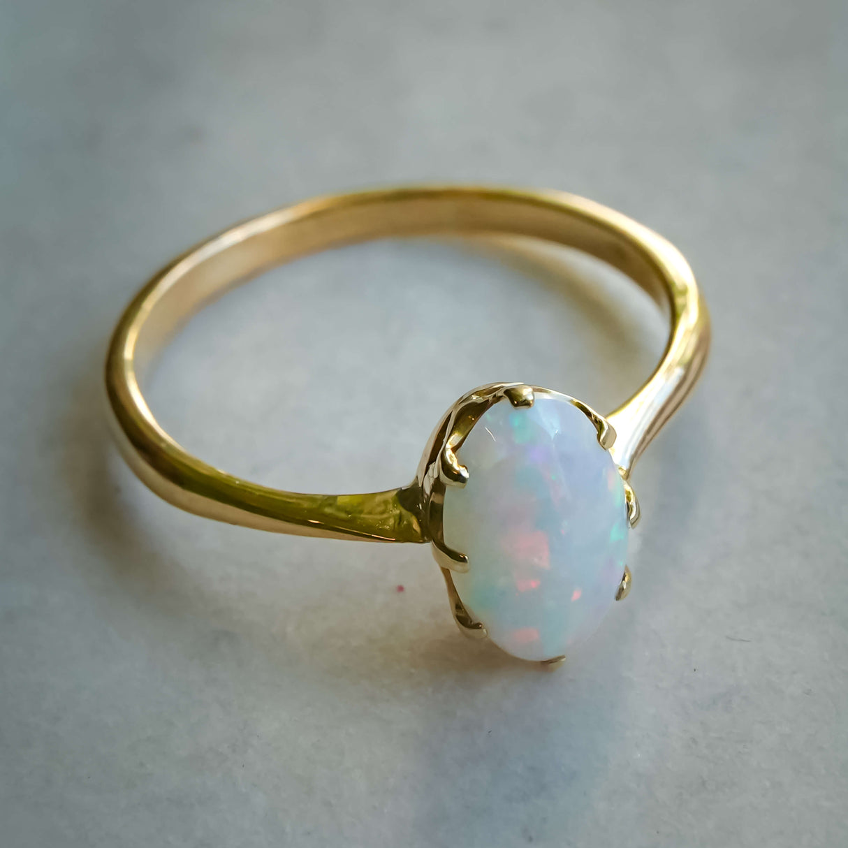 vintage 1990s precious opal solitaire ring in yellow gold