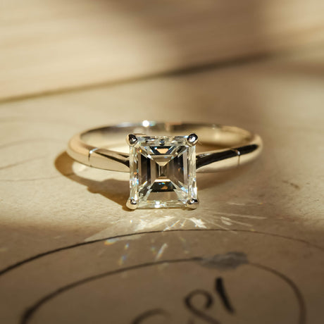 Vintage solitaire diamond ring from the 1980s with platinum band