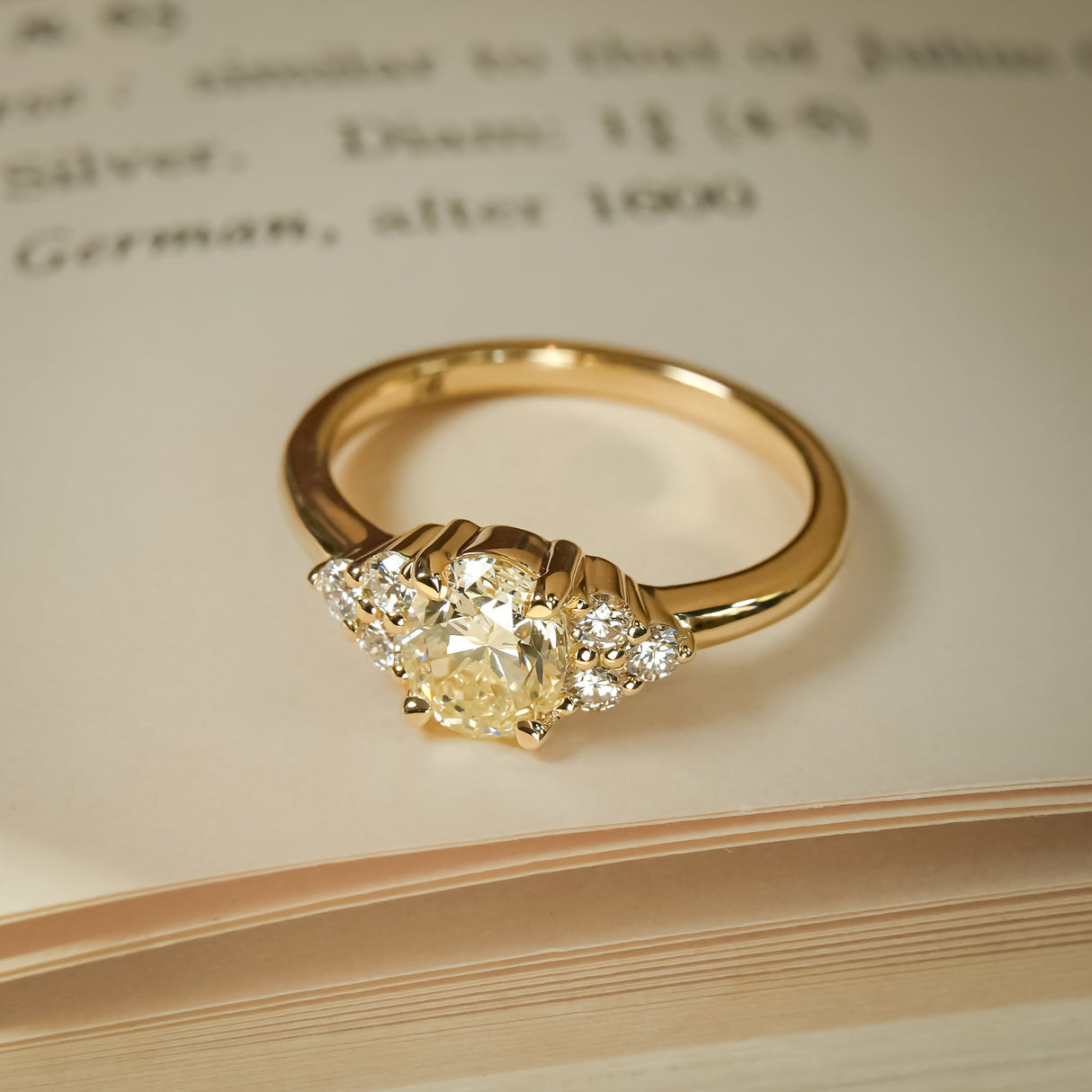 Yellow diamond trefoil cluster engagement ring in yellow gold