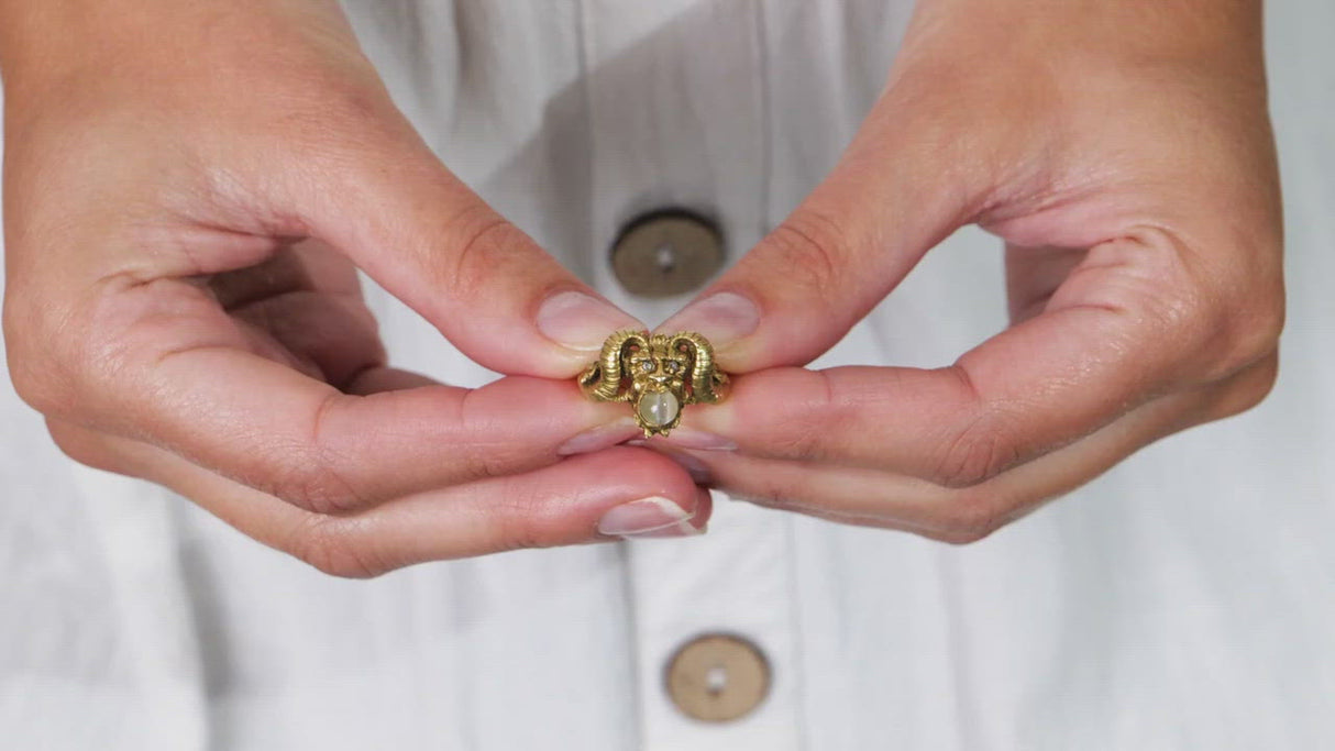 Early 20th century, 18ct gold, cabochon chrysoberyl and diamond 'faun' ring