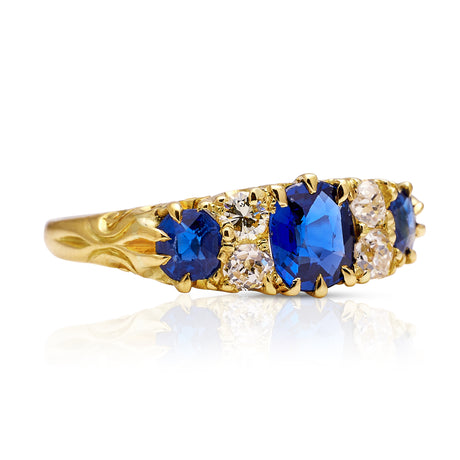 sapphire and diamond engagement ring, side view.