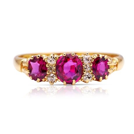 Victorian three-stone ruby and diamond engagement ring, front view. 