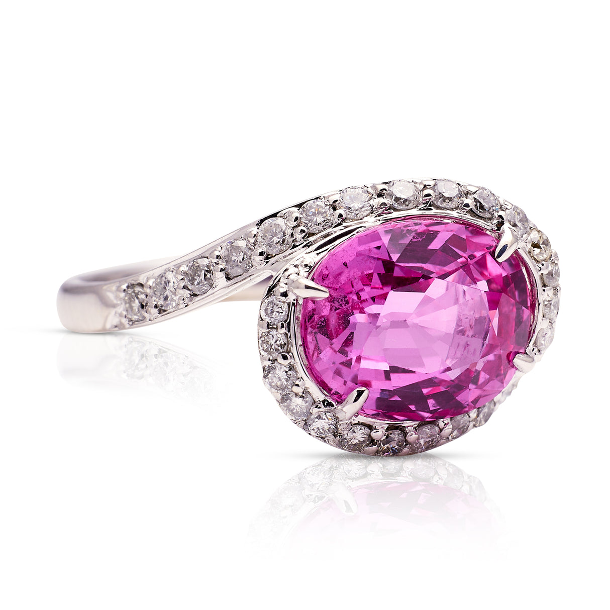 Pink sapphire and diamond engagement ring, side view. 