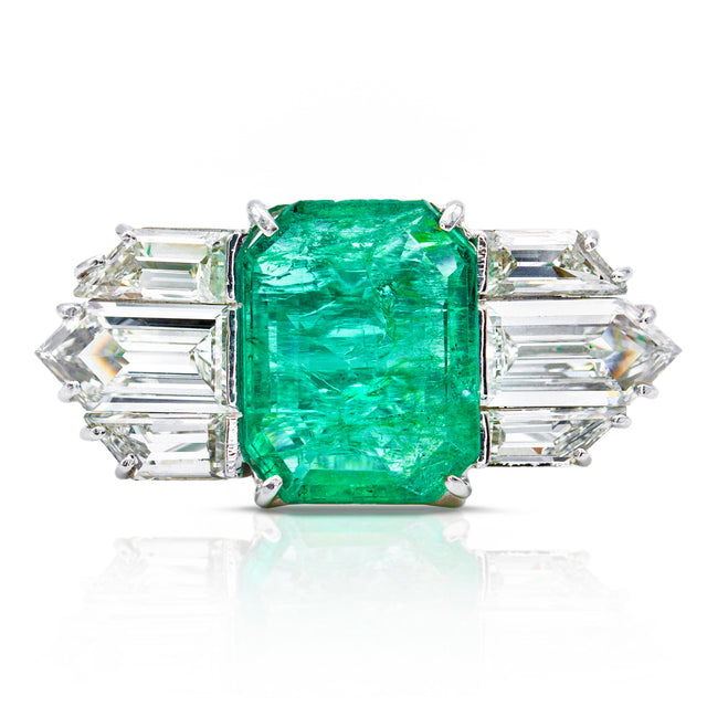 Vintage emerald and diamond engagement ring, front view. 