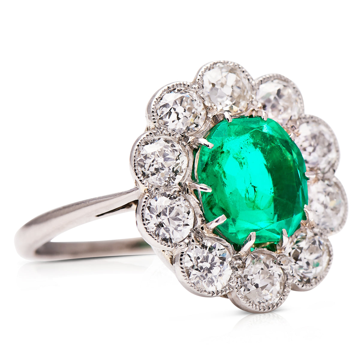 Edwardian, Platinum, Colombian Emerald and Diamond Cluster Ring
