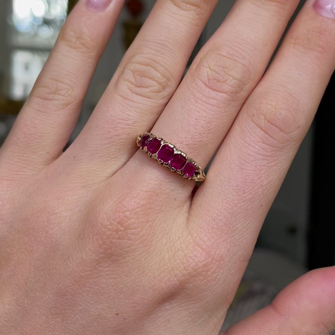 Edwardian five stone ruby band, worn on hand and moved around to give perspective.