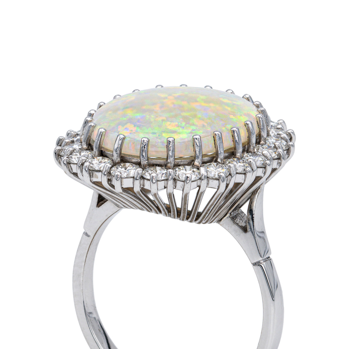 White opal and diamond cluster ring, side view. 