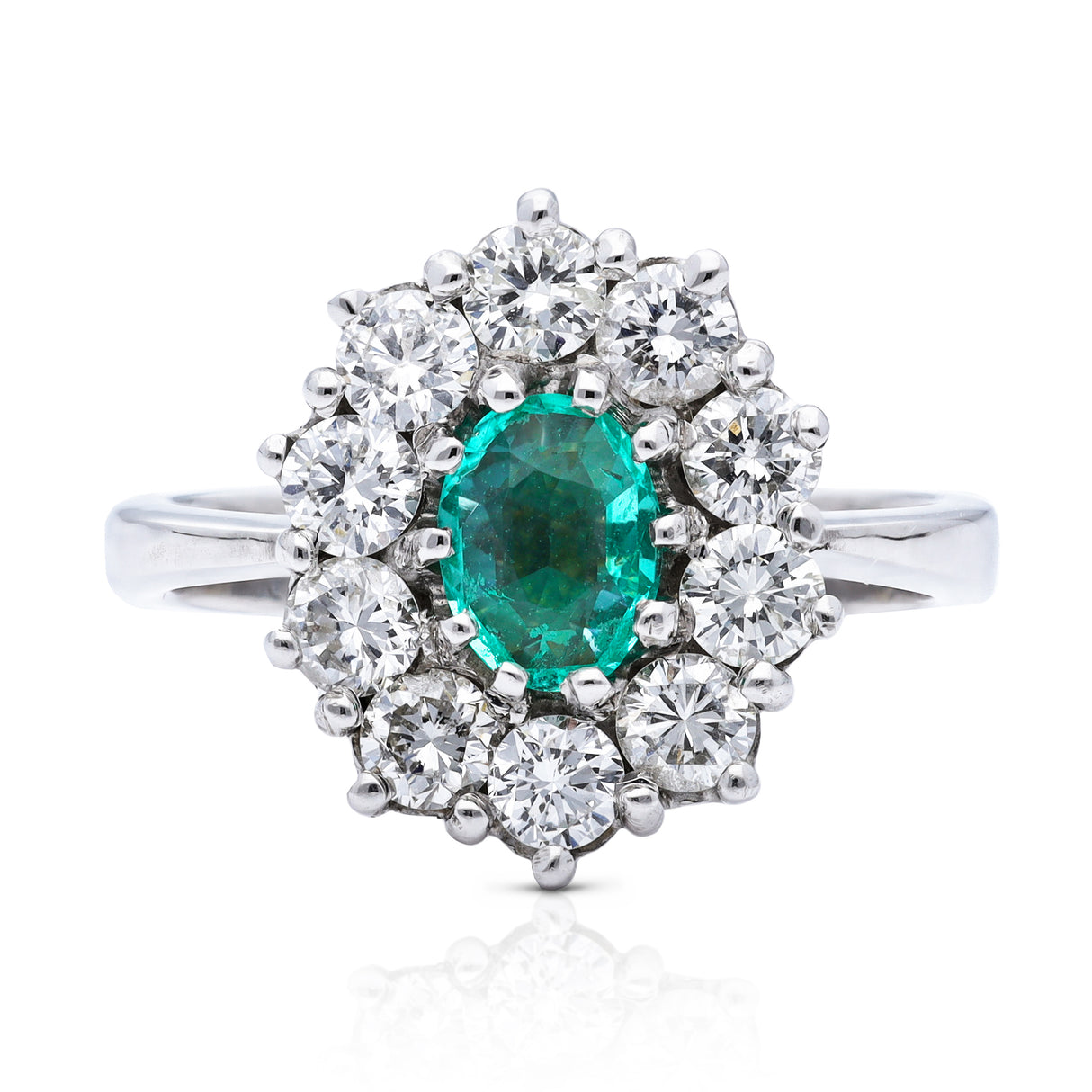 Austrian emerald and diamond cluster engagement ring, front view.