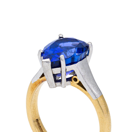 Blue tanzanite single stone ring, side view.