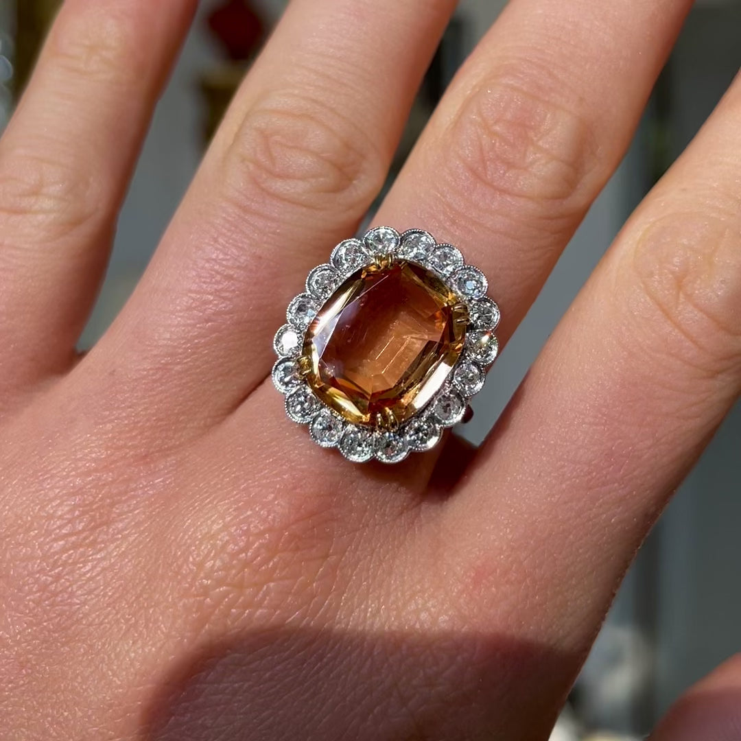 Edwardian, topaz and diamond cluster cocktail ring, worn on hand and rotated to give perspective.