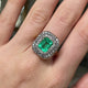 Georgian emerald and diamond cluster, worn on hand and rotated to give perspective.