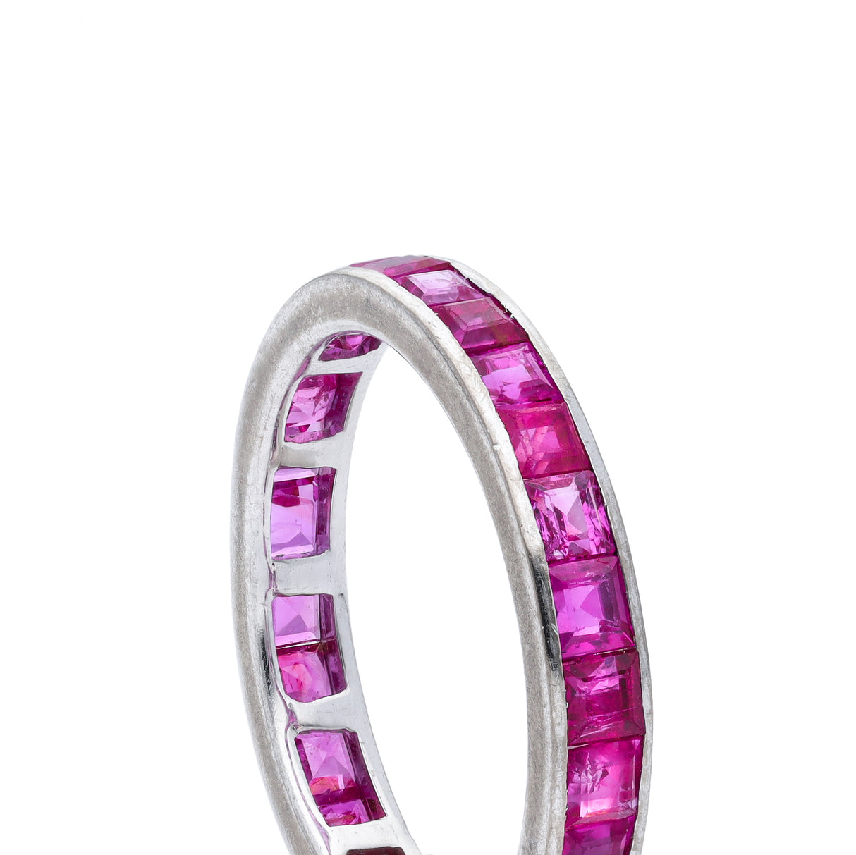 Pink sapphire eternity ring, side view.