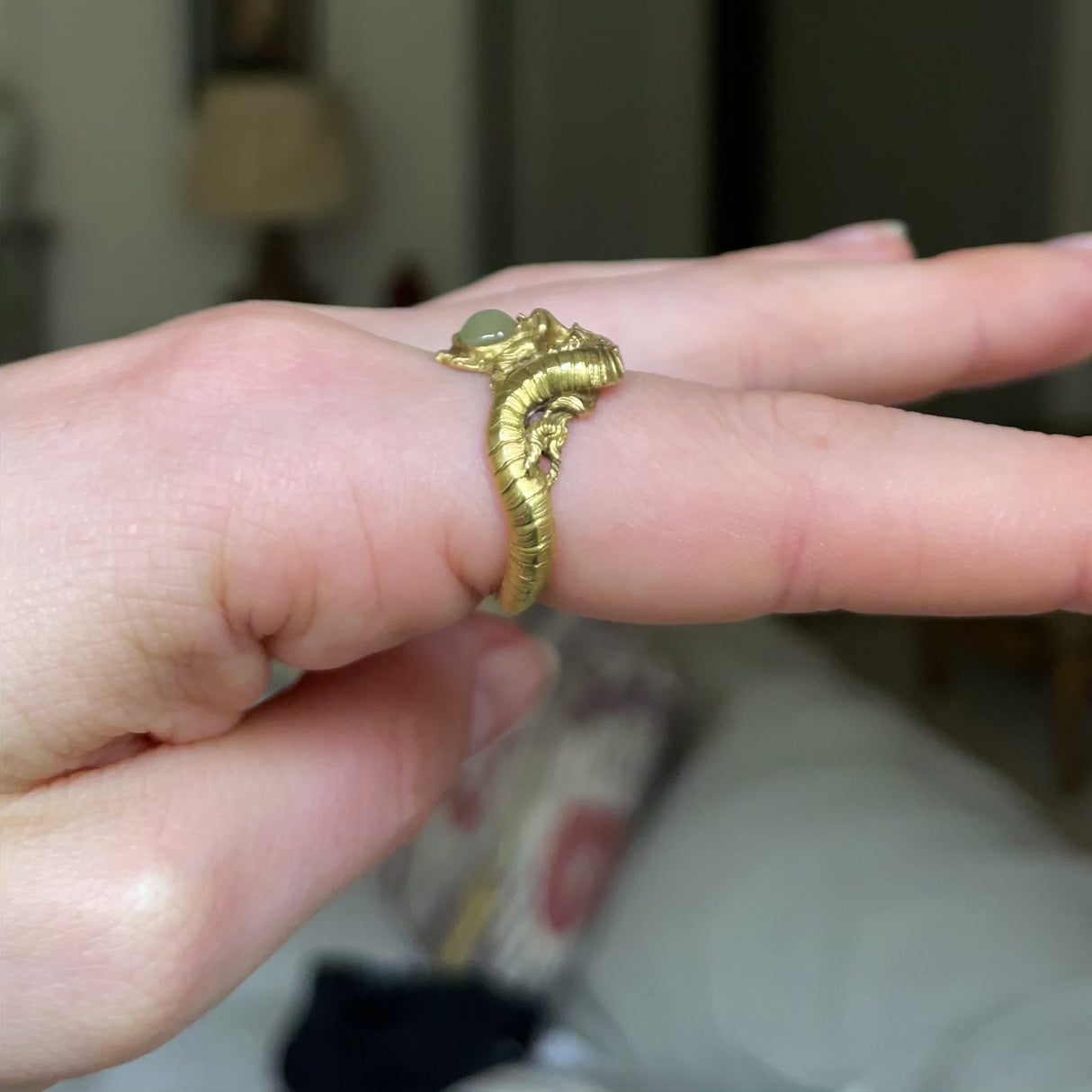 Early 20th century, 18ct gold, cabochon chrysoberyl and diamond 'faun' ring