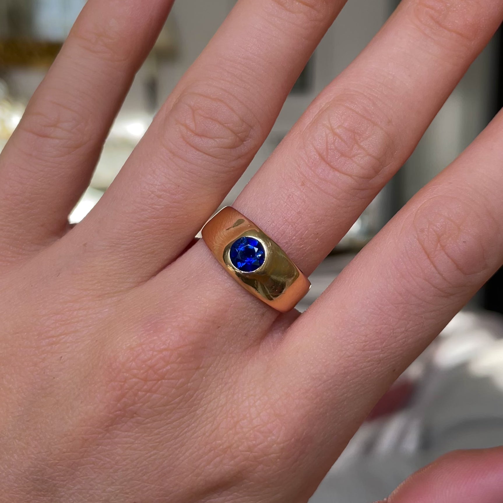 Victorian Burmese sapphire engagement ring, worn on hand and moved around to give perspective.