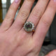 French, Belle Époque 5.06ct green-yellow sapphire and diamond engagement ring
