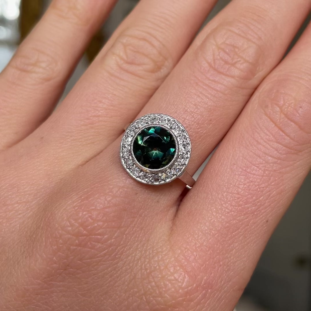 green yellow sapphire and diamond cluster ring, worn on hand and moved around to give perspective. 