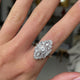 Art Deco diamond navette engagement ring, worn on hand. 