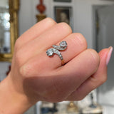vintage toi et moi diamond ring, worn on closed hand.  
