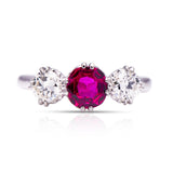 Ruby and diamond three-stone engagement ring, front view.