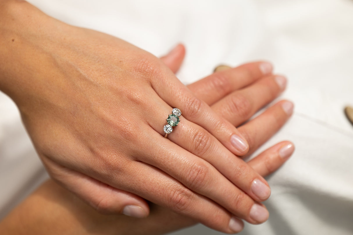 Art Deco, platinum, green sapphire and diamond three stone ring