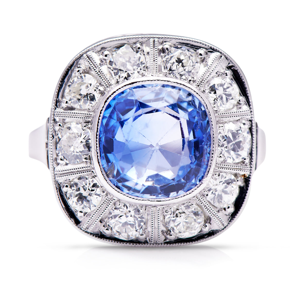 Art Deco, ceylon cushion-cut sapphire and diamond cluster ring, front view.