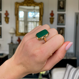 Art Deco chrysoprase and yellow gold ring, worn on hand.