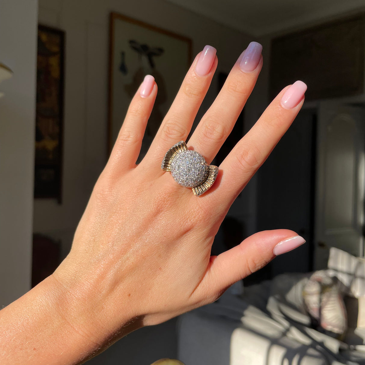 Cartier diamond bombe ring, front view worn on hand.