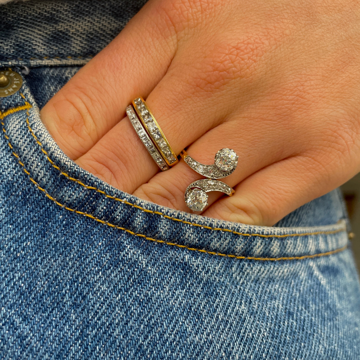 vintage toi et moi diamond ring, worn on hand in pocket of jeans.