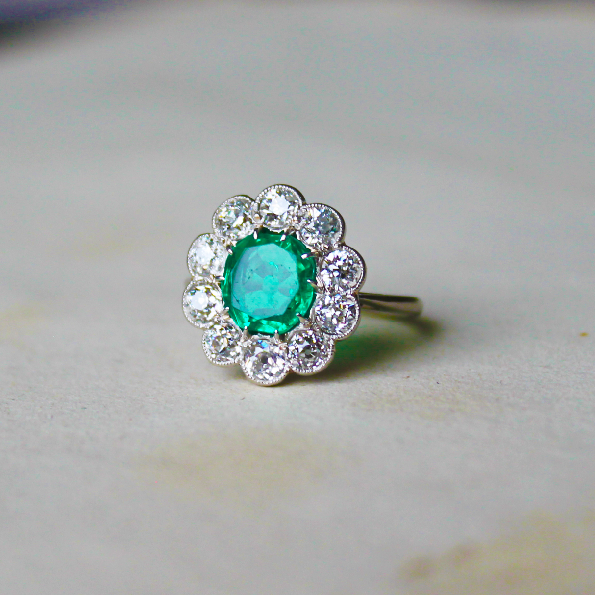 Edwardian, Platinum, Colombian Emerald and Diamond Cluster Ring