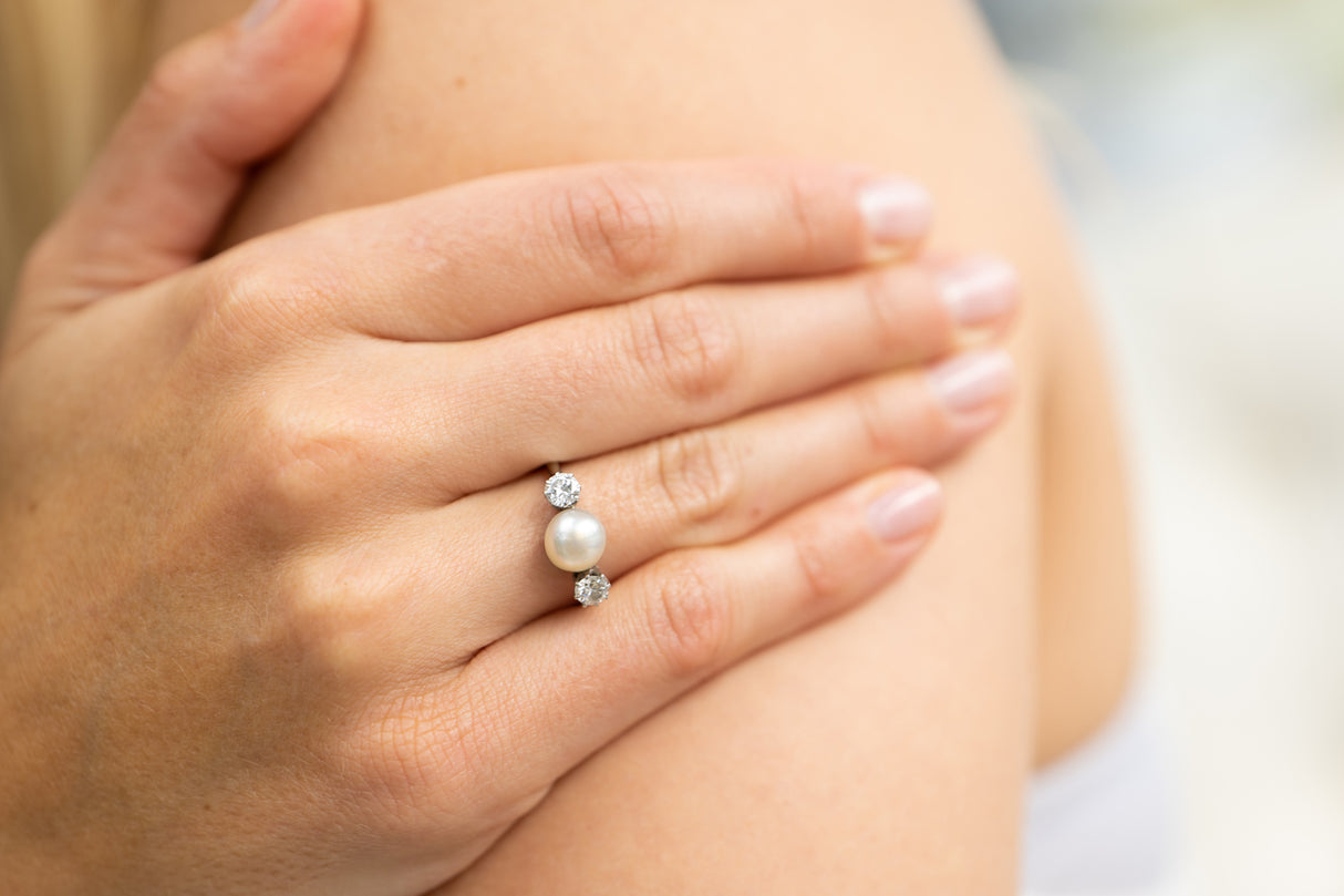 Edwardian, platinum, natural pearl and diamond three stone ring