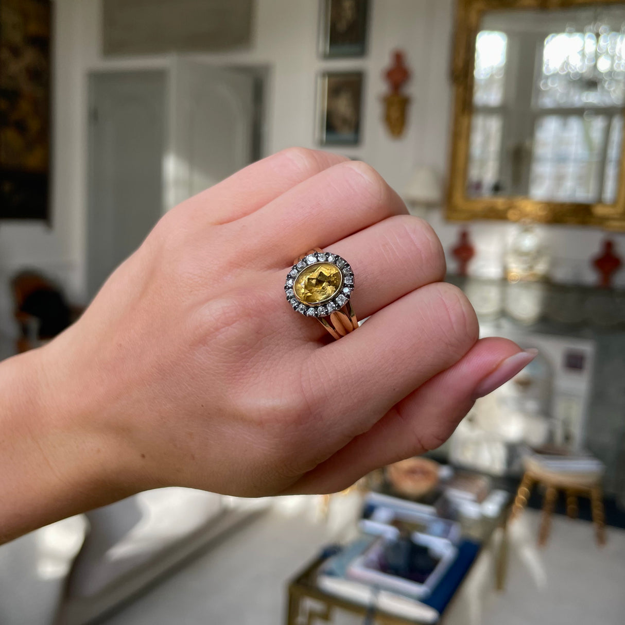 Antique Georgian citrine and diamond cluster ring, worn on hand.