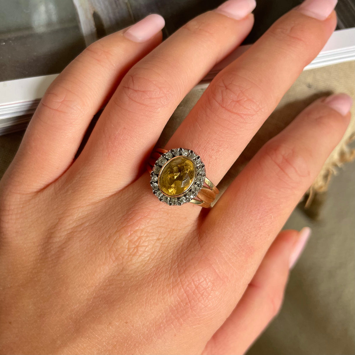 Antique Georgian citrine and diamond cluster ring, worn on hand.