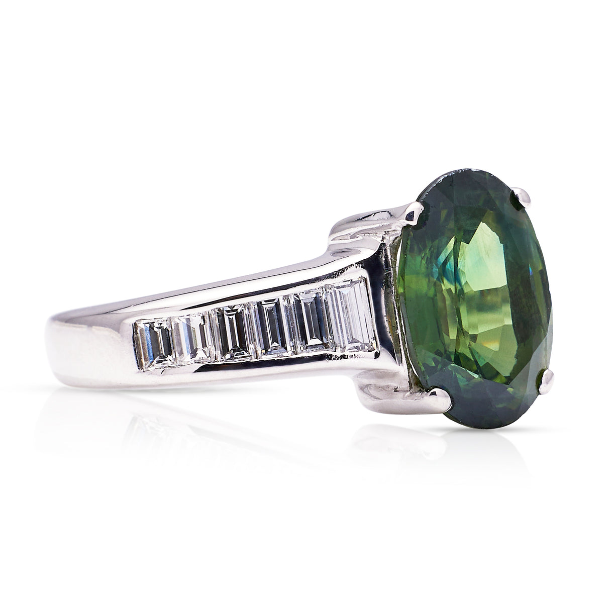 Green sapphire and diamond engagement ring, side view. 