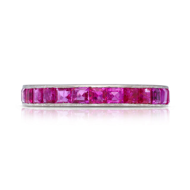 Pink sapphire eternity ring, front view.