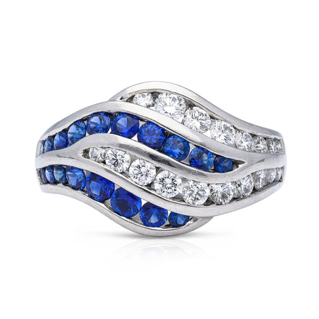 An unusual sapphire and diamond wave ring, front view.