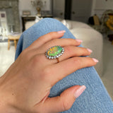 Antique opal and paste cluster ring, worn on hand.
