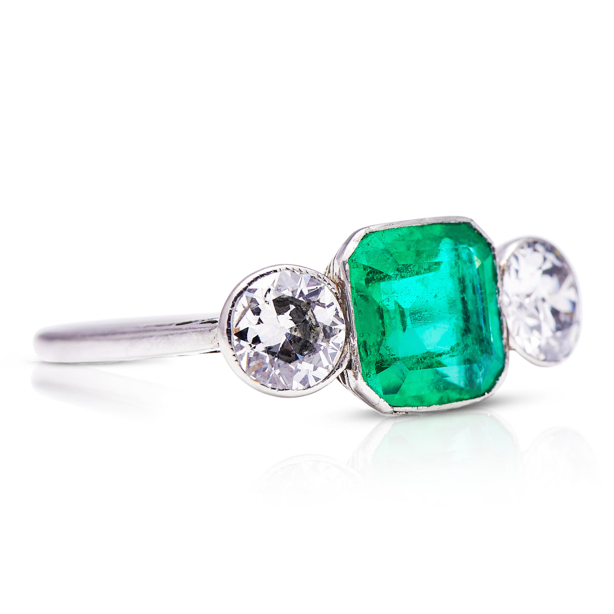 Art Deco | platinum, brazilian emerald & diamond three-stone ring