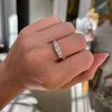Victorian five stone diamond engagement ring, worn on hand.