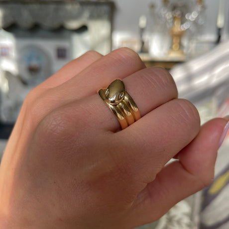 Victorian diamond set snake ring, worn on hand.