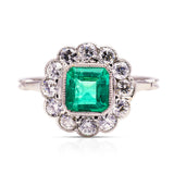 Edwardian emerald and diamond cluster ring, front view. 