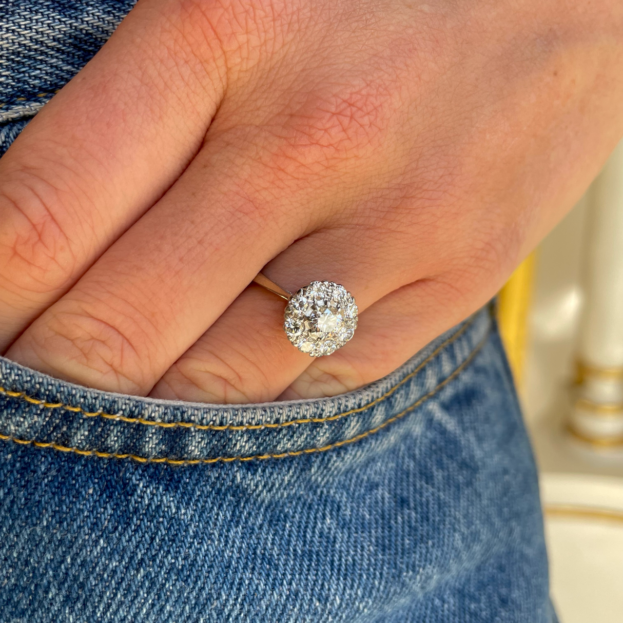 Vintage Art Deco white gold diamond cluster engagement ring, worn on hand. 