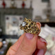 Vintage textured 18ct yellow gold nugget diamond ring, held in fingers and rotated to give perspective.