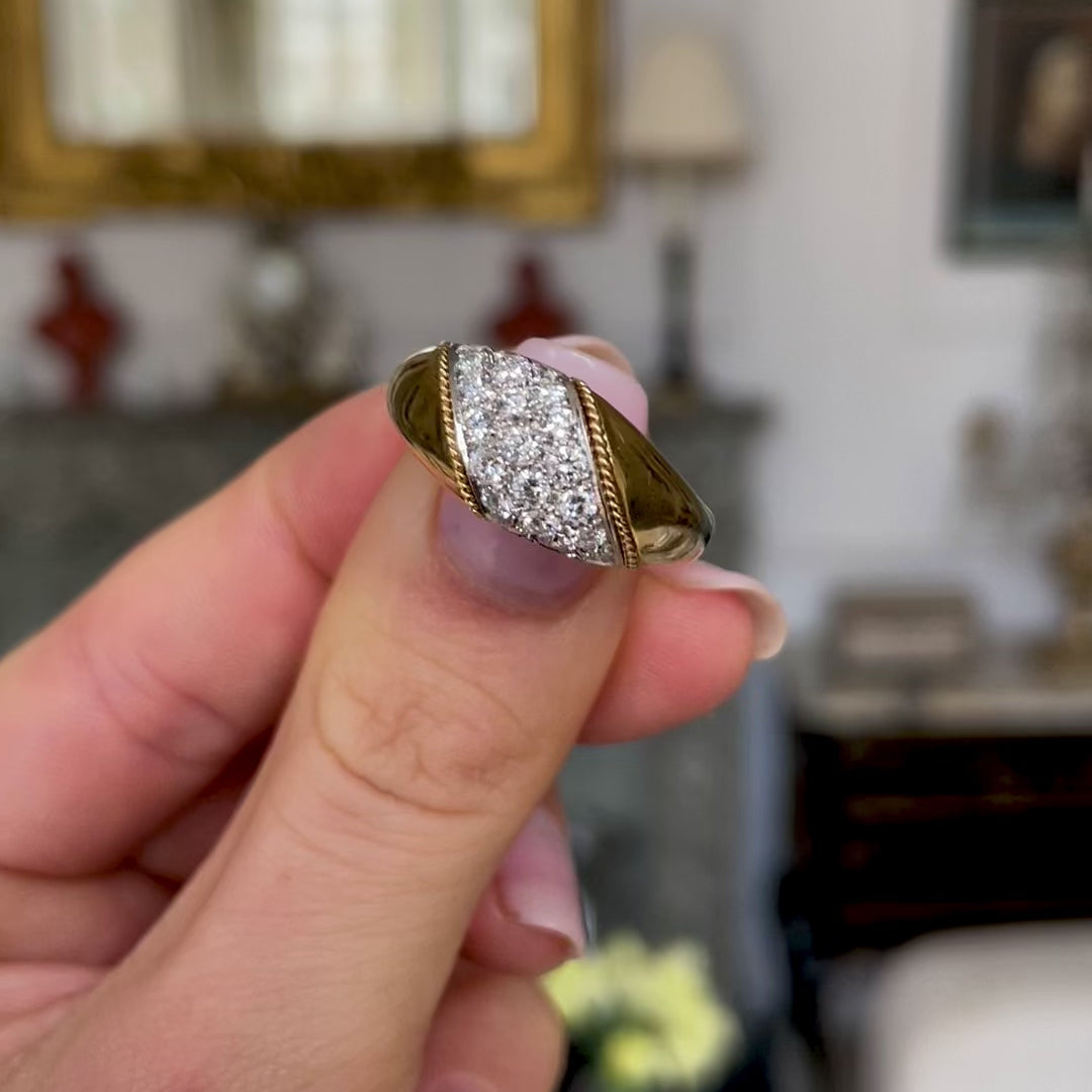 Asprey diamond and yellow gold band, held in fingers and moved around to give perspective.