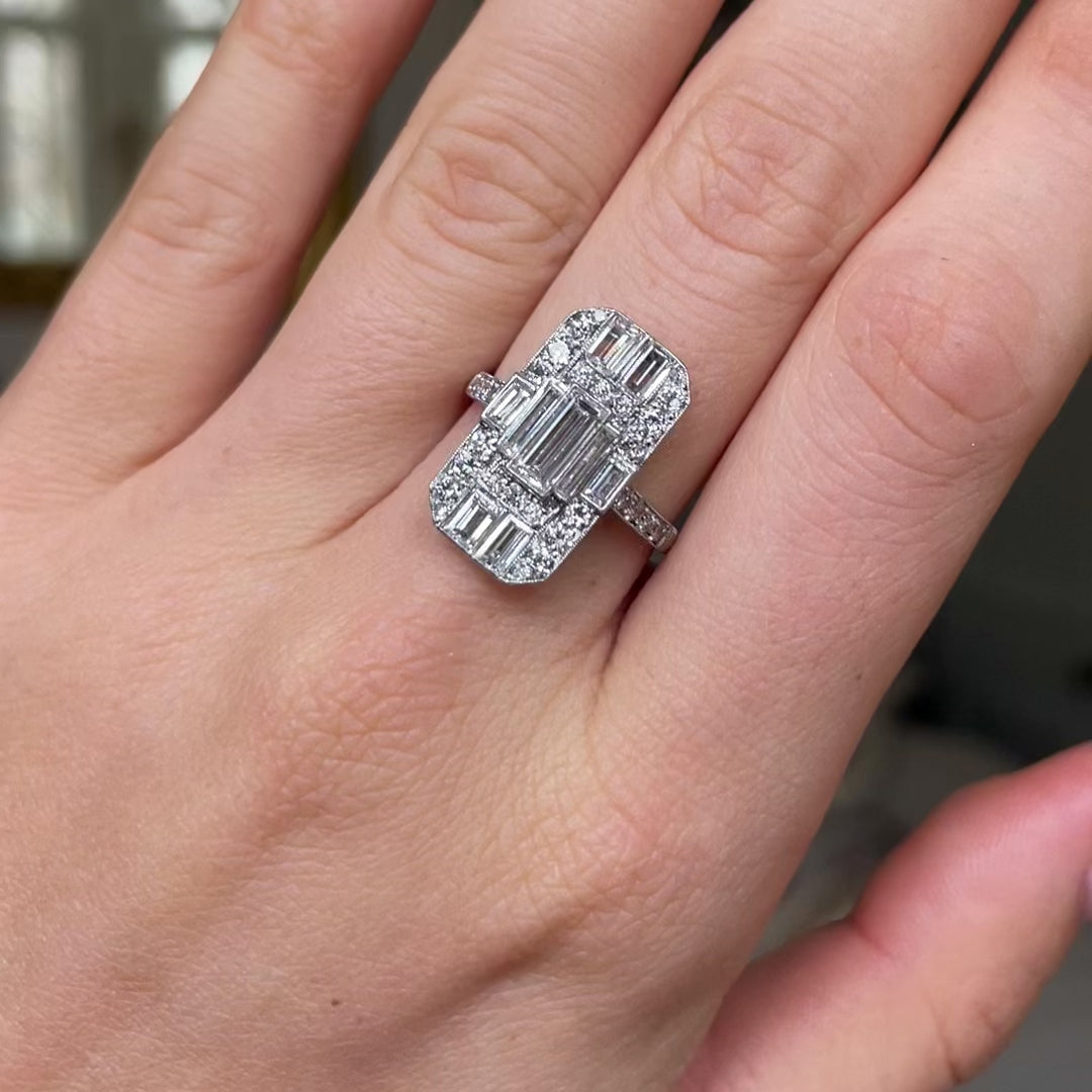 Art Deco diamond panel ring, worn on hand and rotated to give perspective.