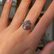 Antique Giardinetti sapphire ring, worn on hand and moved away from camera to give perspective.